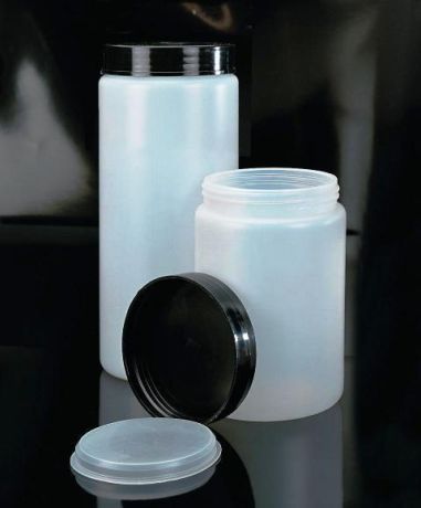 Storage container with screw cap and inner plug