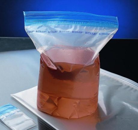 Leak-proof sample storage bag with double safety closure